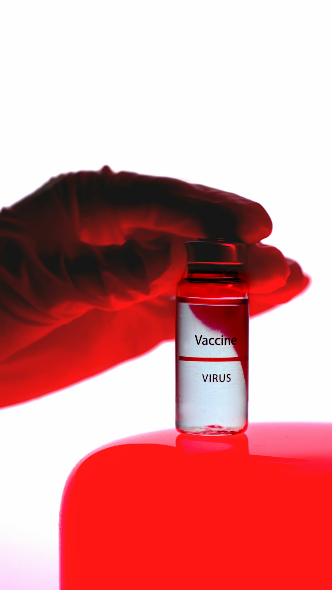 Person Holding a Vaccine Vial